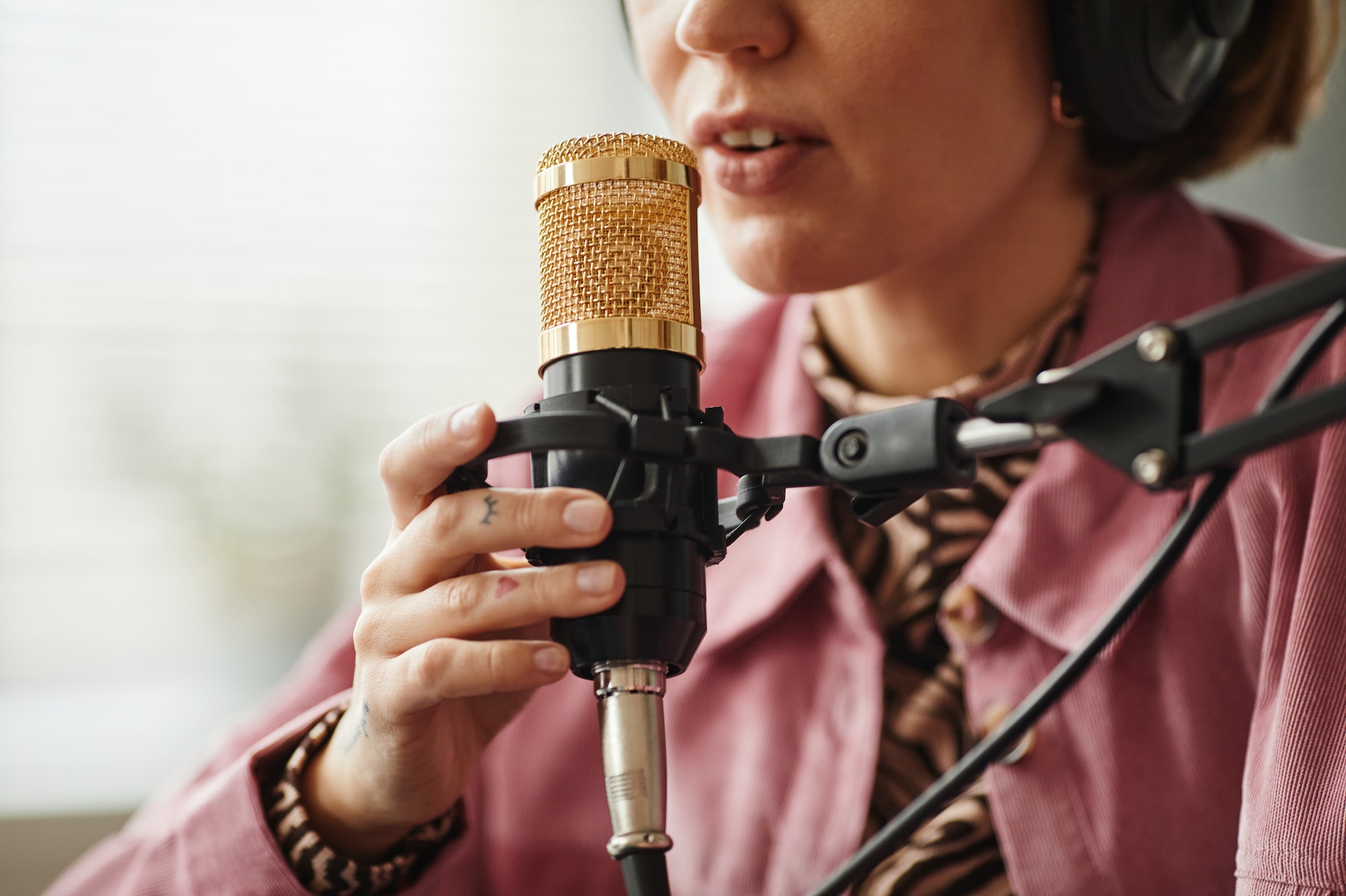 Woman Speaking to Microphone Close Up